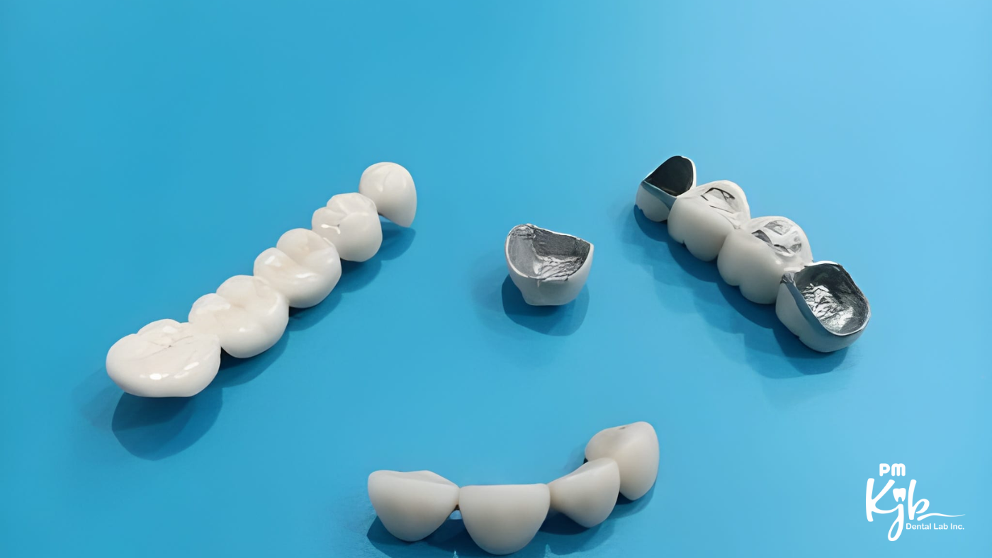 Dental crowns and bridge on blue background
